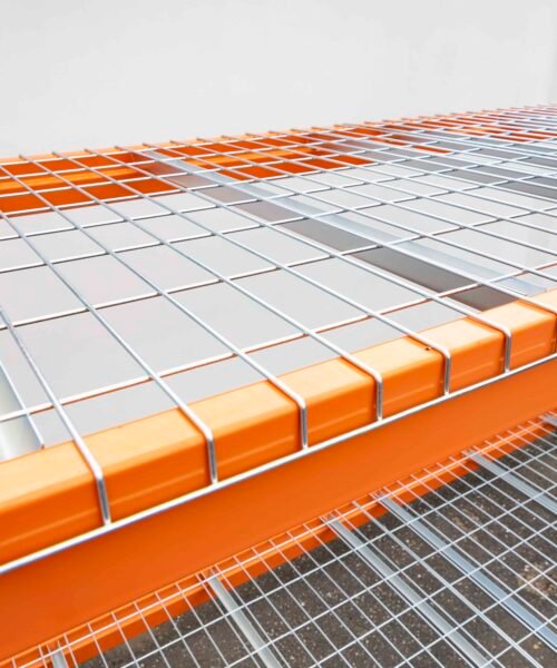 Heavy-duty industrial pallet rack with safety features and wire mesh decking.